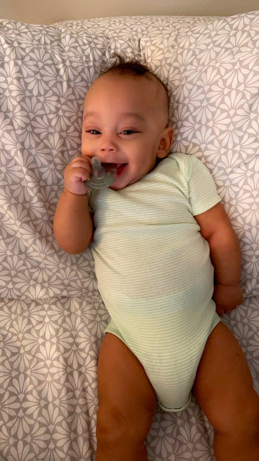 Dior is registered to the contest to win money with this photo: baby, baby_toddler_clothing, cheek, chest, comfort, finger, happy, head, human_body, infant_bodysuit, iris, knee, lip, organ, person, skin, sleeve, smile, stomach, thigh