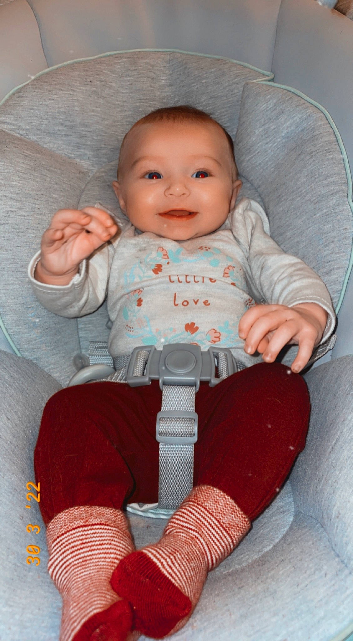 Gracelyn joined the competition — help win amazing prizes! baby, baby_toddler_clothing, chair, cheek, clothing, comfort, eye, finger, head, human_body, lap, mouth, person, pink, skin, sleeve, smile, sock, textile, thigh