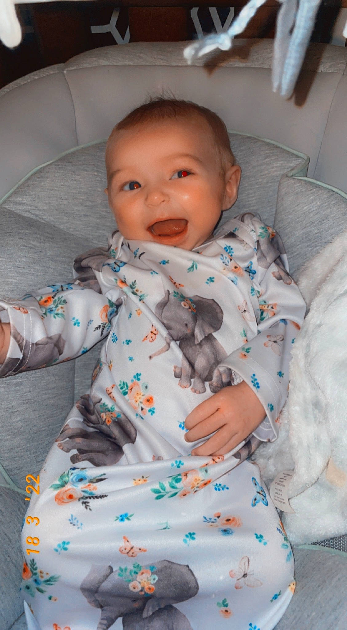 Gracelyn is registered to the contest to win money with this photo: arm, baby, baby_toddler_clothing, cheek, chin, comfort, dress, eye, face, facial_expression, hair, hairstyle, hand, head, human, mouth, nose, outerwear, person, skin