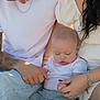 baby, infant, sleeping, family, hand_holding, casual_clothing, jeans, white_shirt, bracelet, tattoo, outdoor, natural_light, close_up, parent, mother, father, skin, barefoot, candid, love