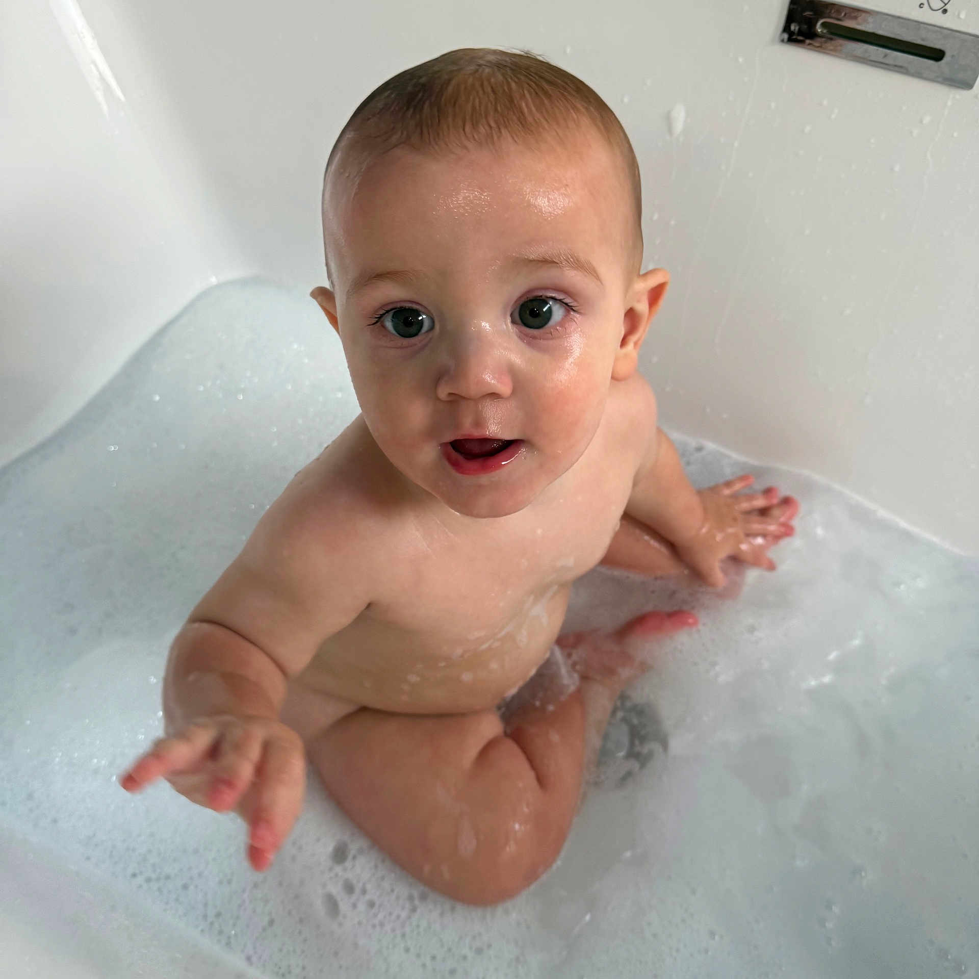 Brett joined the competition — help win amazing prizes! baby, bath, bathtub, bubbles, child, cute, expression, face, hand, indoors, infant, naked, person, playful, sitting, skin, toddler, water, wet, young