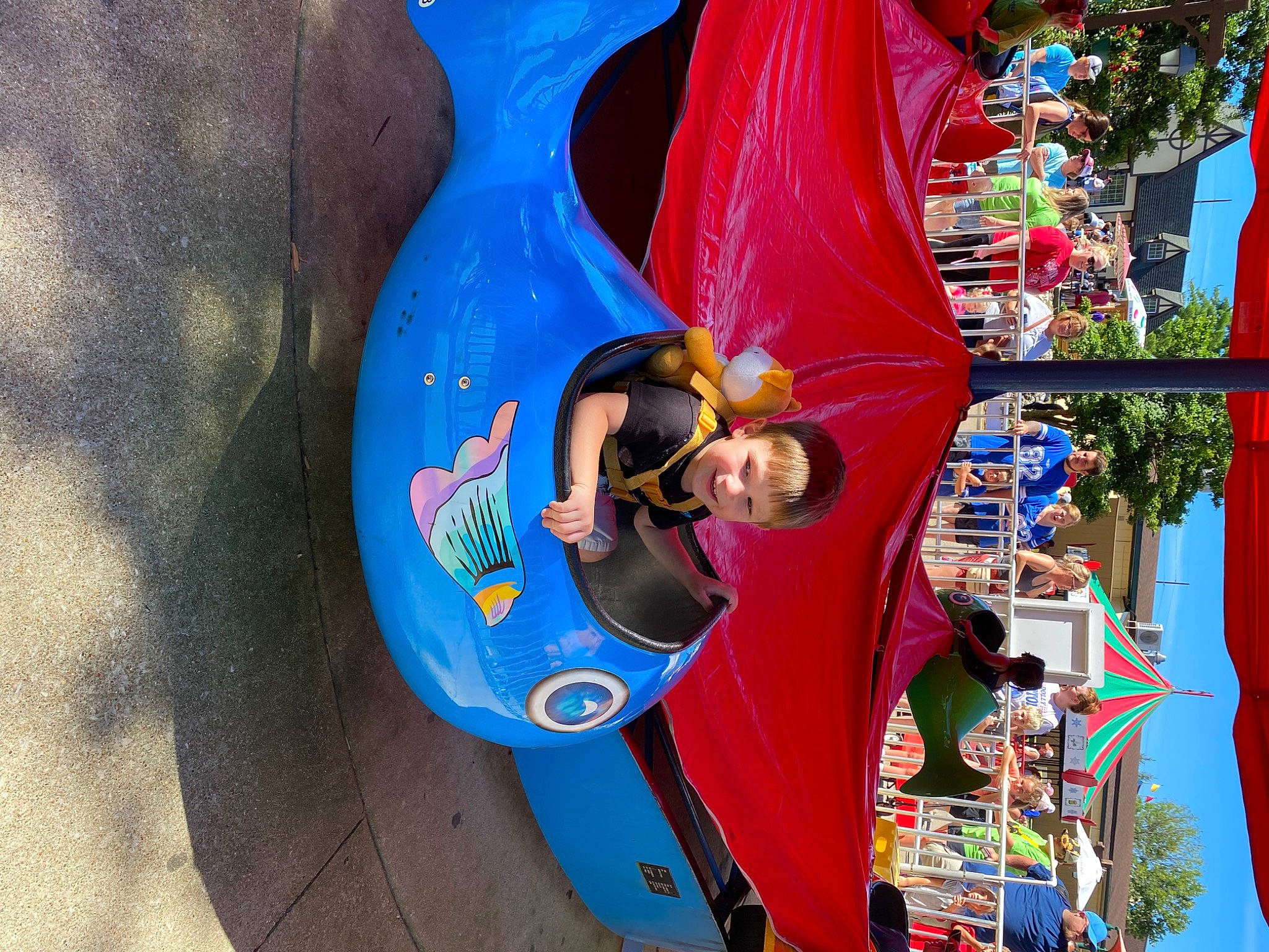 Corbyn is registered to the contest to win money with this photo: amusement_park, amusement_ride, chute, city, electric_blue, event, fair, fun, joy, leisure, nonbuilding_structure, outdoor_play_equipment, person, play, playground, playground_slide, recreation, smile, toddler, travel