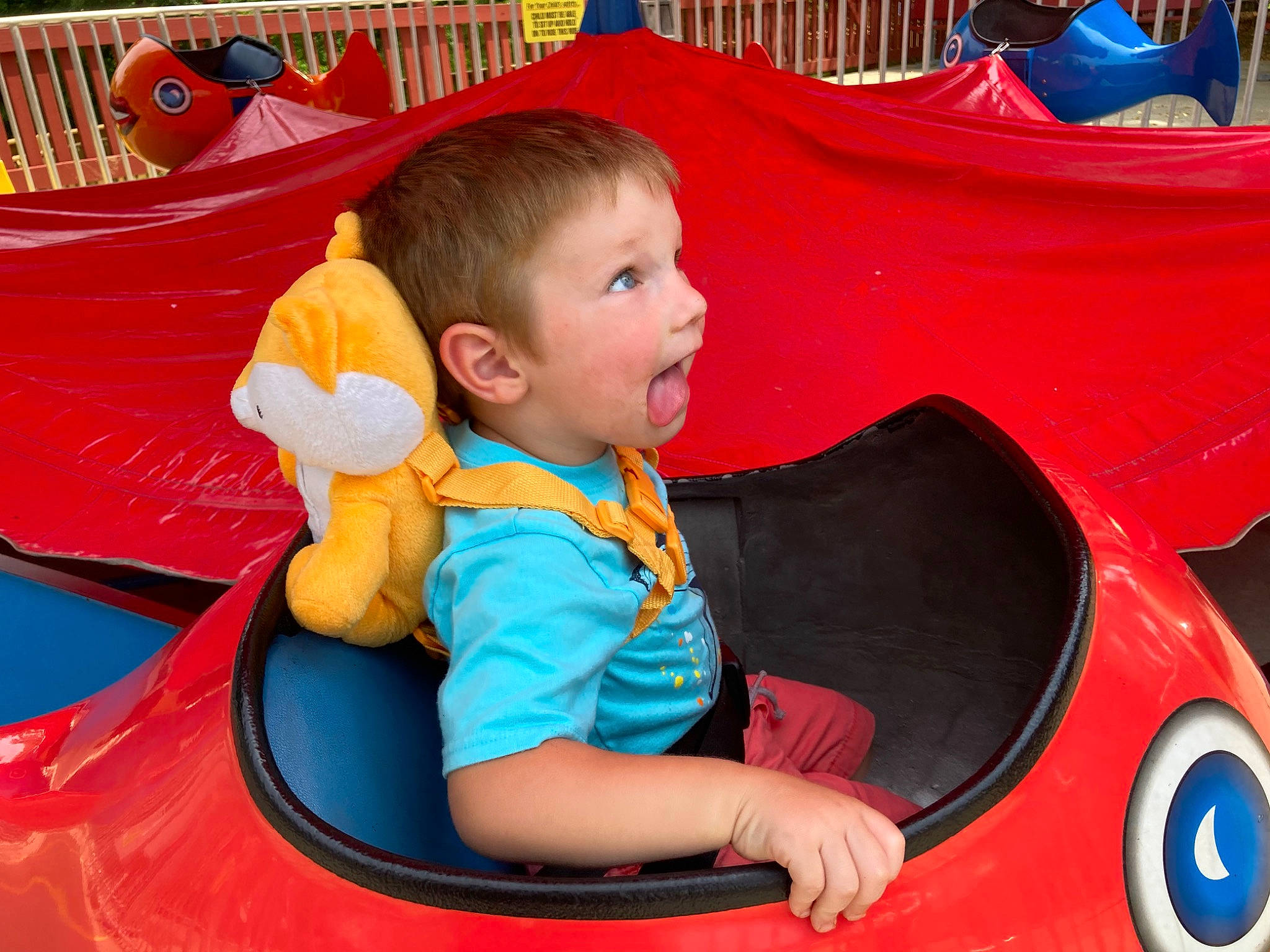 Corbyn joined the competition — help win amazing prizes! automotive_design, automotive_exterior, bumper, car, child, fun, green, happy, leisure, motor_vehicle, person, photograph, product, recreation, red, riding_toy, snapshot, toddler, vehicle, wheel