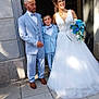 wedding, bride, groom, child, bouquet, flower, dress, suit, outdoor, smile, glasses, stairs, stone_wall, formal_wear, happy, family, people, portrait, sunlight, celebration
