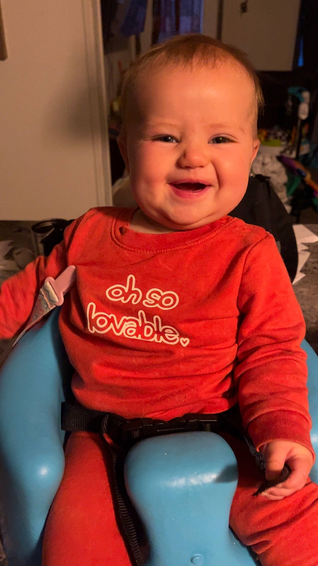 Lyndi joined the competition — help win amazing prizes! baby, babylaughing, bodypart, chair, clothing, cushion, face, finger, furniture, hand, happy, head, homedecor, laughing, person, photography, portrait, sitting, smile, t_shirt