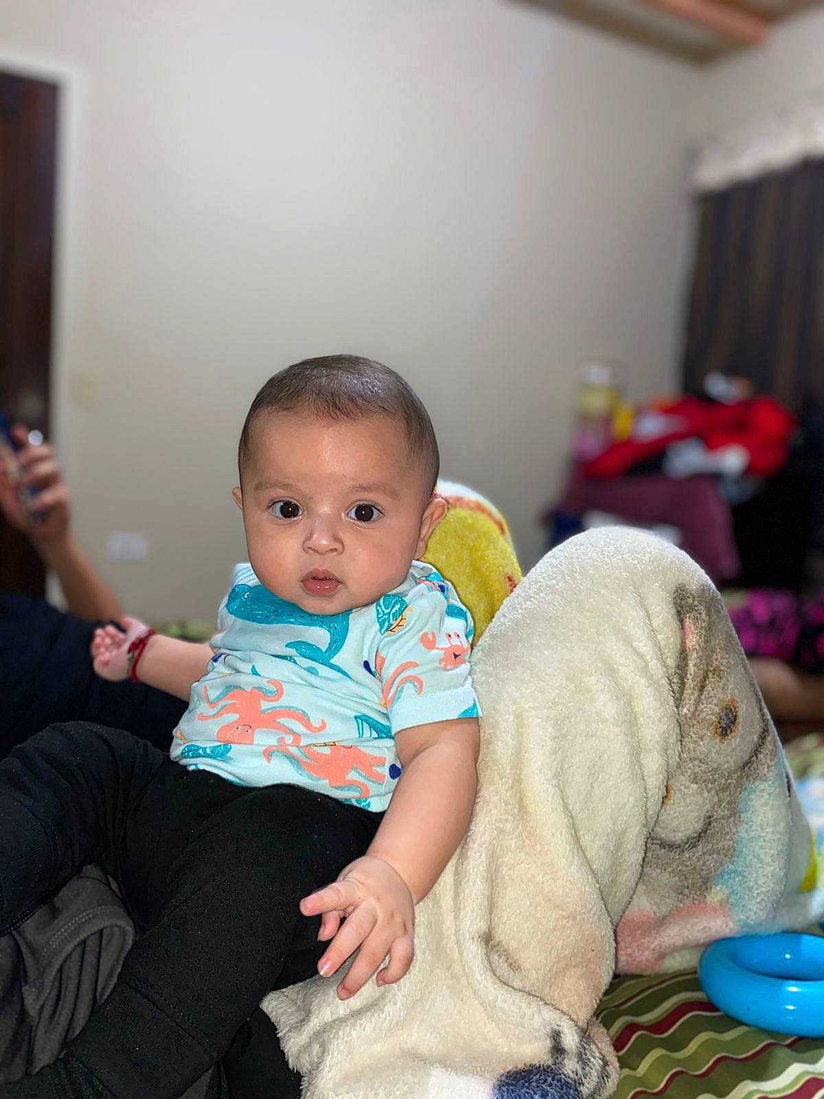 Emiliano joined the competition — help win amazing prizes! baby, baby_playing_with_toys, baby_toddler_clothing, child, comfort, couch, curtain, event, finger, flooring, fun, happy, leisure, living_room, person, sitting, skin, sock, standing, thigh