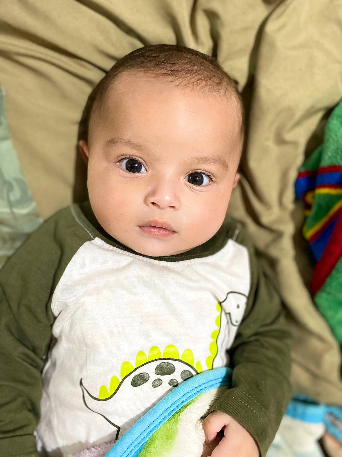 Emiliano joined the competition — help win amazing prizes! baby, baby_toddler_clothing, cheek, chin, cool, eye, eyebrow, eyelash, facial_expression, green, head, iris, lip, mammal, mouth, nose, organ, person, skin, sleeve