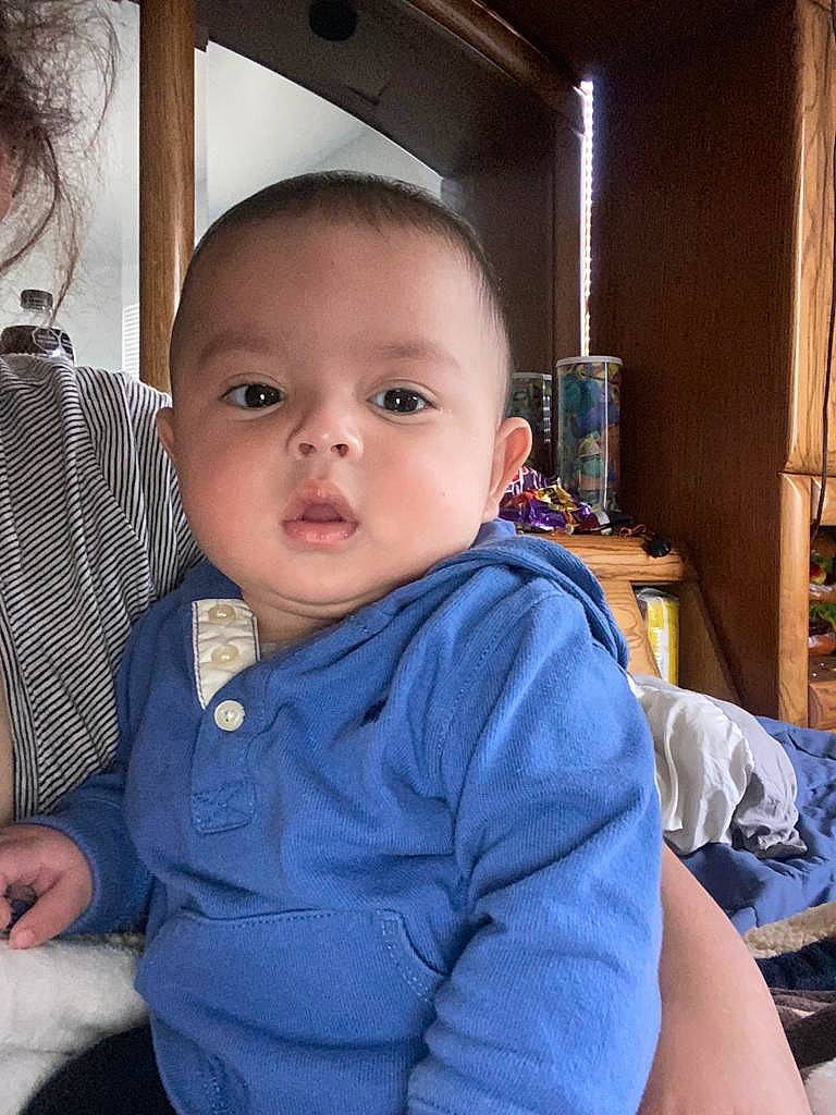 Emiliano joined the competition — help win amazing prizes! baby, baby_toddler_clothing, cheek, comfort, curtain, ear, eyebrow, eyelash, finger, forehead, happy, iris, lip, mouth, neck, nose, person, shoulder, skin, sleeve