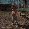 Alaiyah is registered to the contest to win money with this photo: child, toddler, stick, swing, playground, outdoor, trees, bare_trees, gravel, daylight, sky, park, person, clothing, shoes, shadow, expression, photography, text_overlay, butterfly_emoji