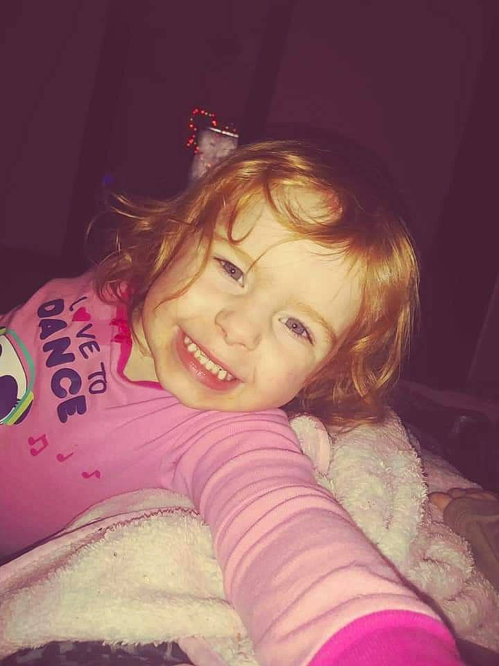 Novalee is registered to the contest to win money with this photo: arm, beauty, cheek, child, cool, eye, face, facial_expression, forehead, fun, hair, head, joy, lip, nose, person, pink, purple, shoulder, skin