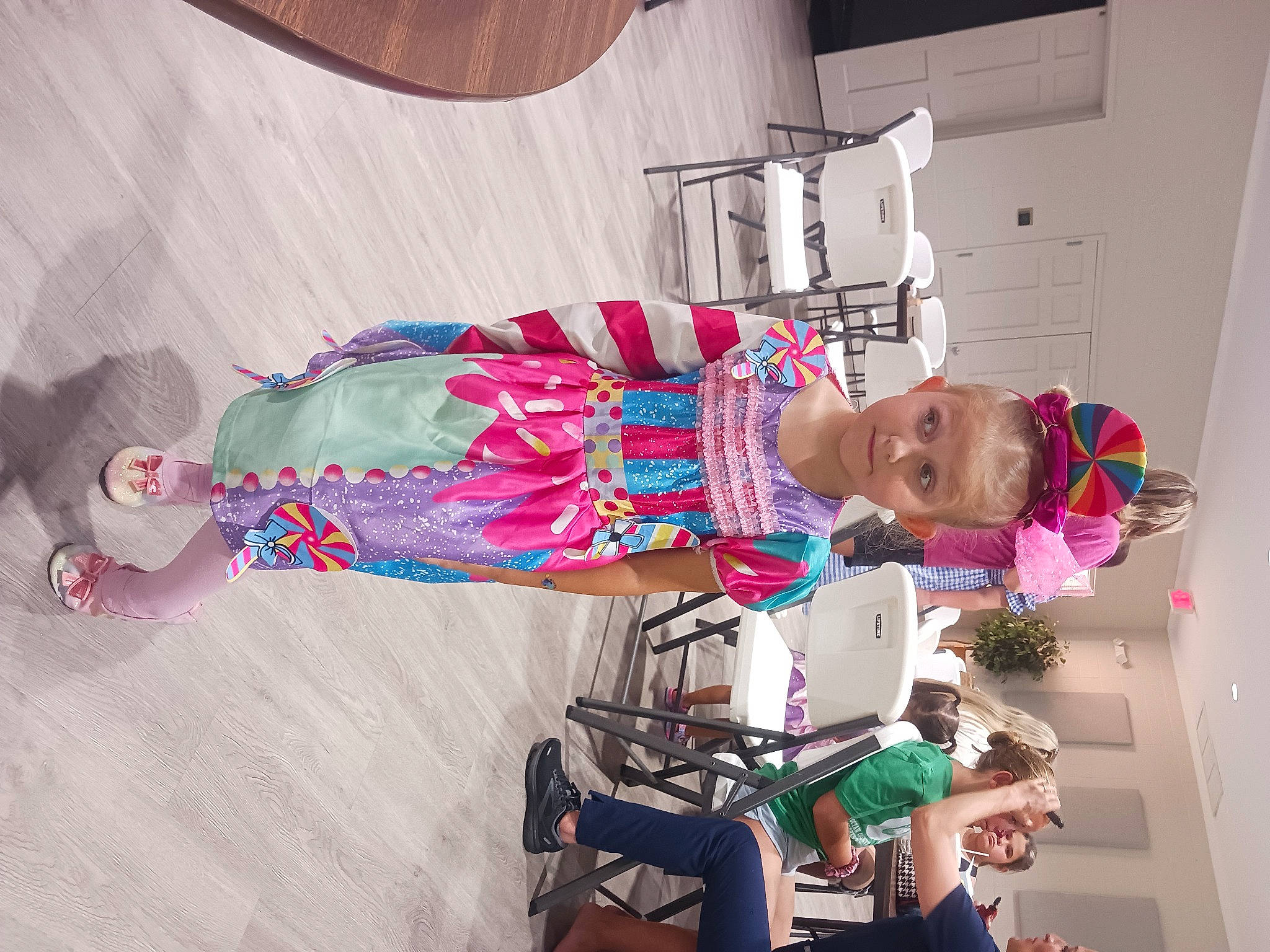 Phoenix is registered to the contest to win money with this photo: child, costume, fashion_design, flooring, fun, magenta, person, pink, room, textile, toddler