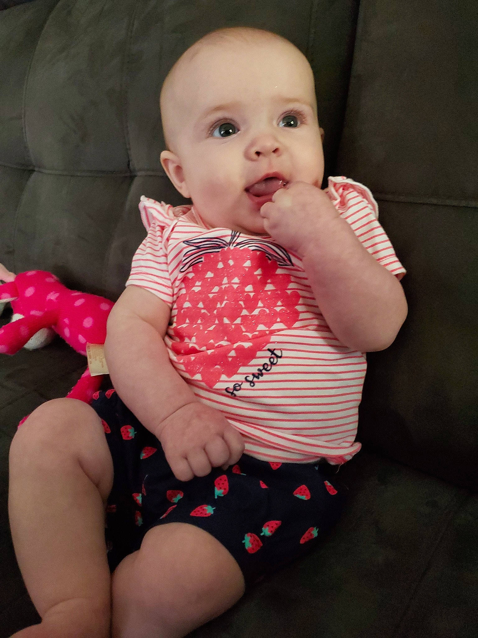 Skyleigh is registered to the contest to win money with this photo: baby, baby_products, baby_toddler_clothing, beauty, cheek, child, design, dress, face, head, leg, lip, pattern, person, pink, polka_dot, product, red, sitting, skin