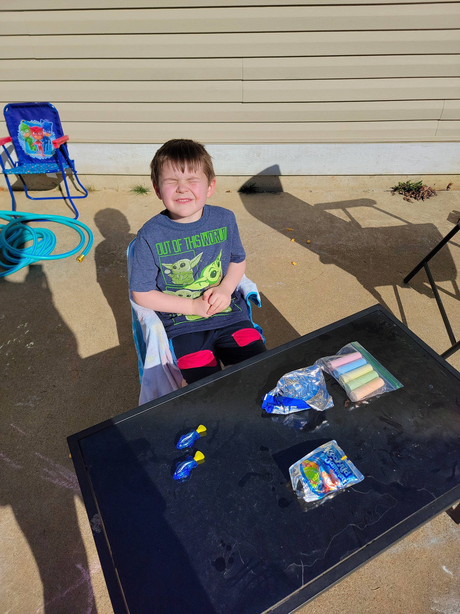 Lucas is registered to the contest to win money with this photo: art, box, child, communication_device, design, fun, gadget, leisure, person, play, recreation, shorts, sitting, smile, space, t_shirt, table, tablet_computer, toddler, toy