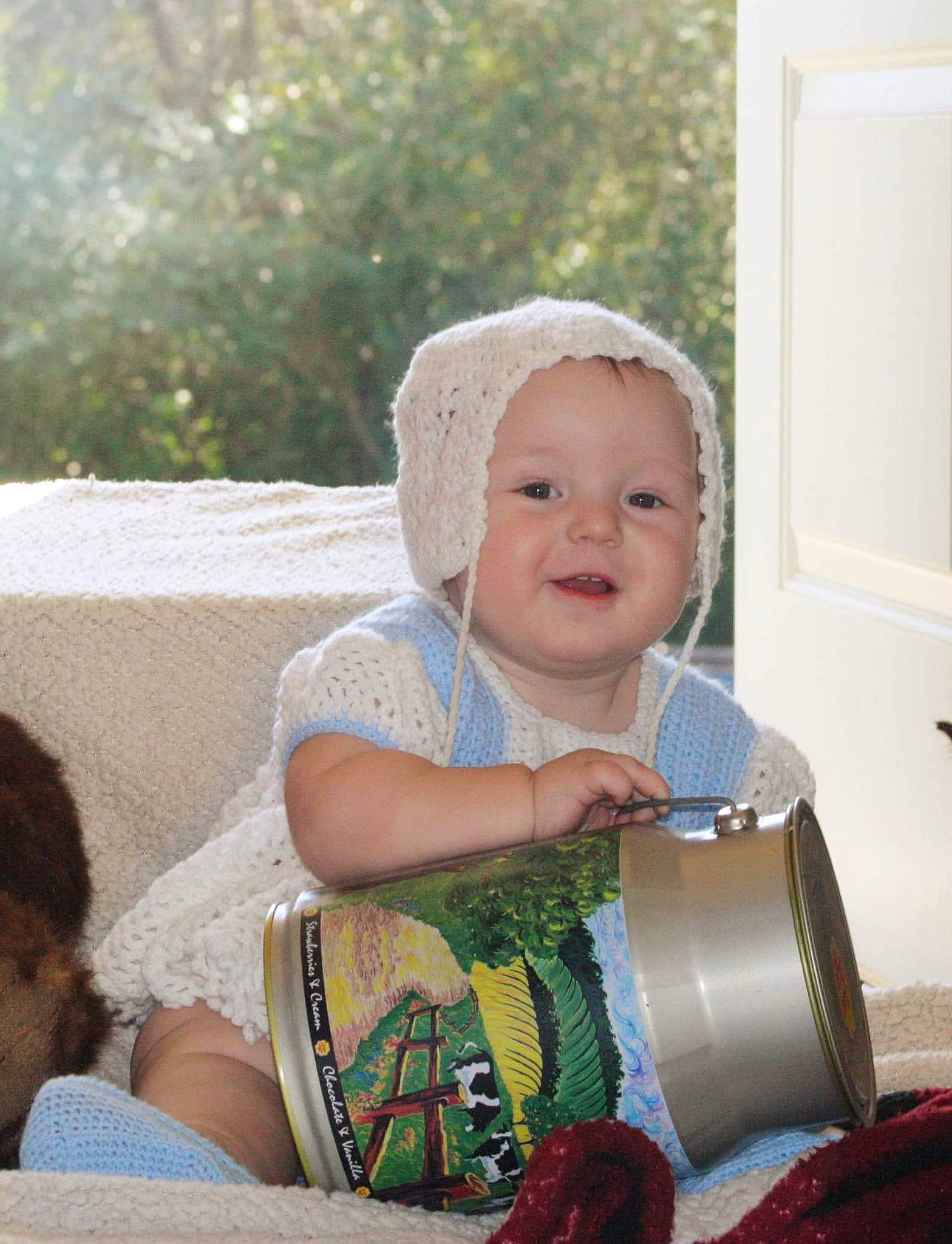 Savanna is registered to the contest to win money with this photo: baby, child, eye, family, headgear, people, person, sitting, skin, smile, toddler, vacation