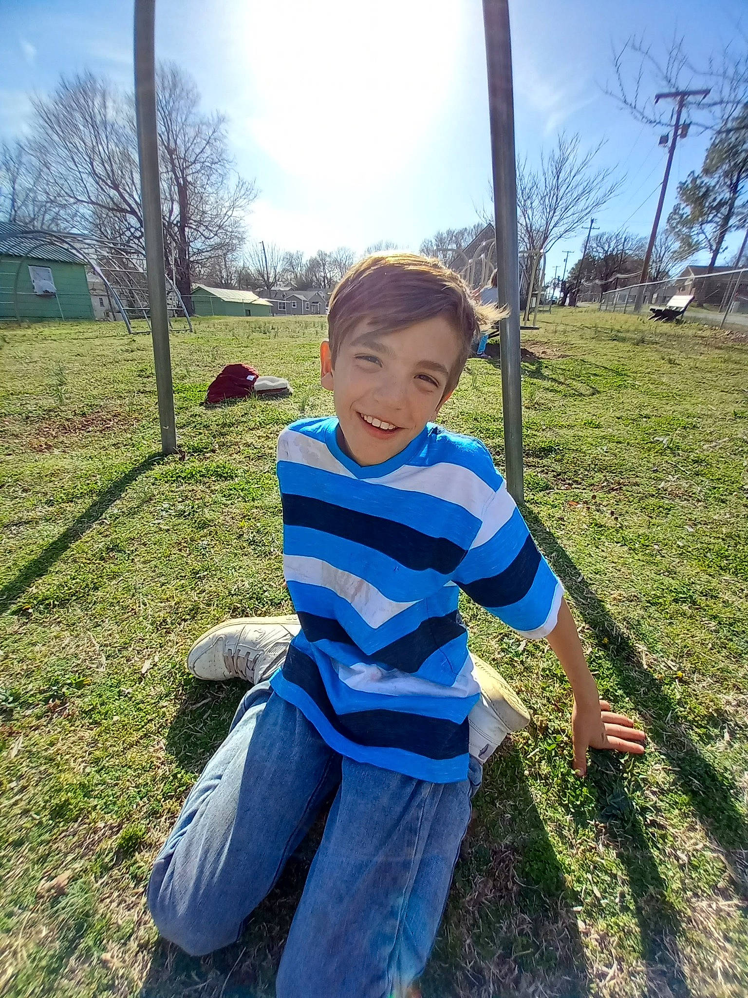Bently is registered to the contest to win money with this photo: electric_blue, fun, grass, grassland, happy, joy, landscape, lawn, leisure, pasture, people_in_nature, person, plant, recreation, shadow, sitting, sky, soil, t_shirt, toddler