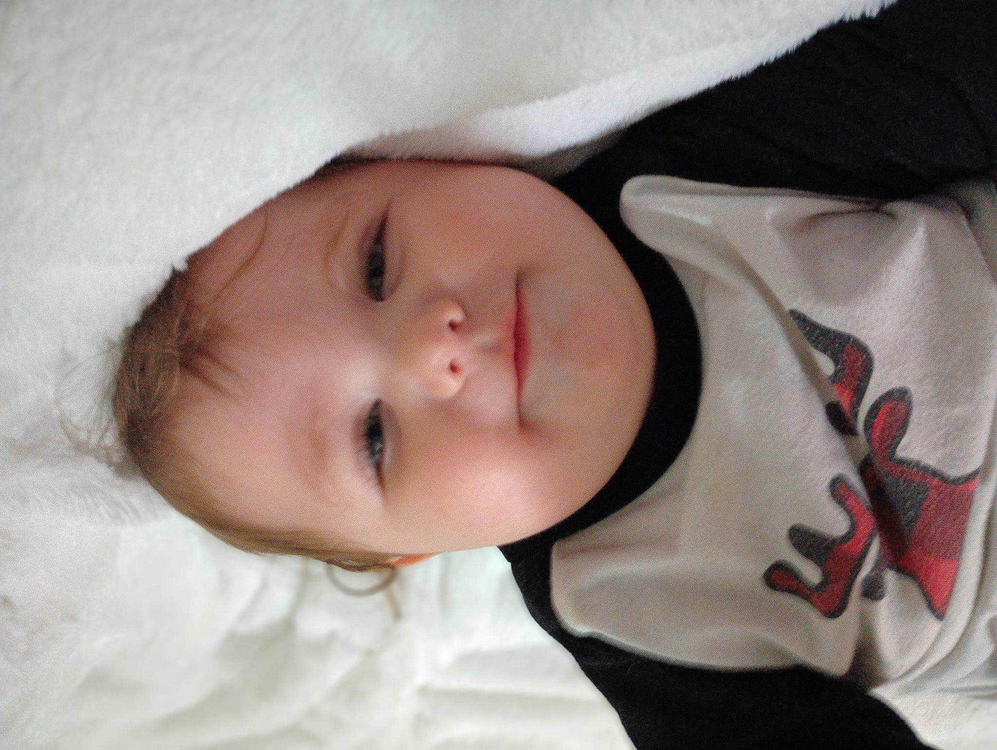 Everly is registered to the contest to win money with this photo: baby, baby_toddler_clothing, carmine, cheek, child, collar, comfort, eye, eyebrow, eyelash, fur, iris, linens, lip, nose, person, portrait_photography, skin, sleeve, textile