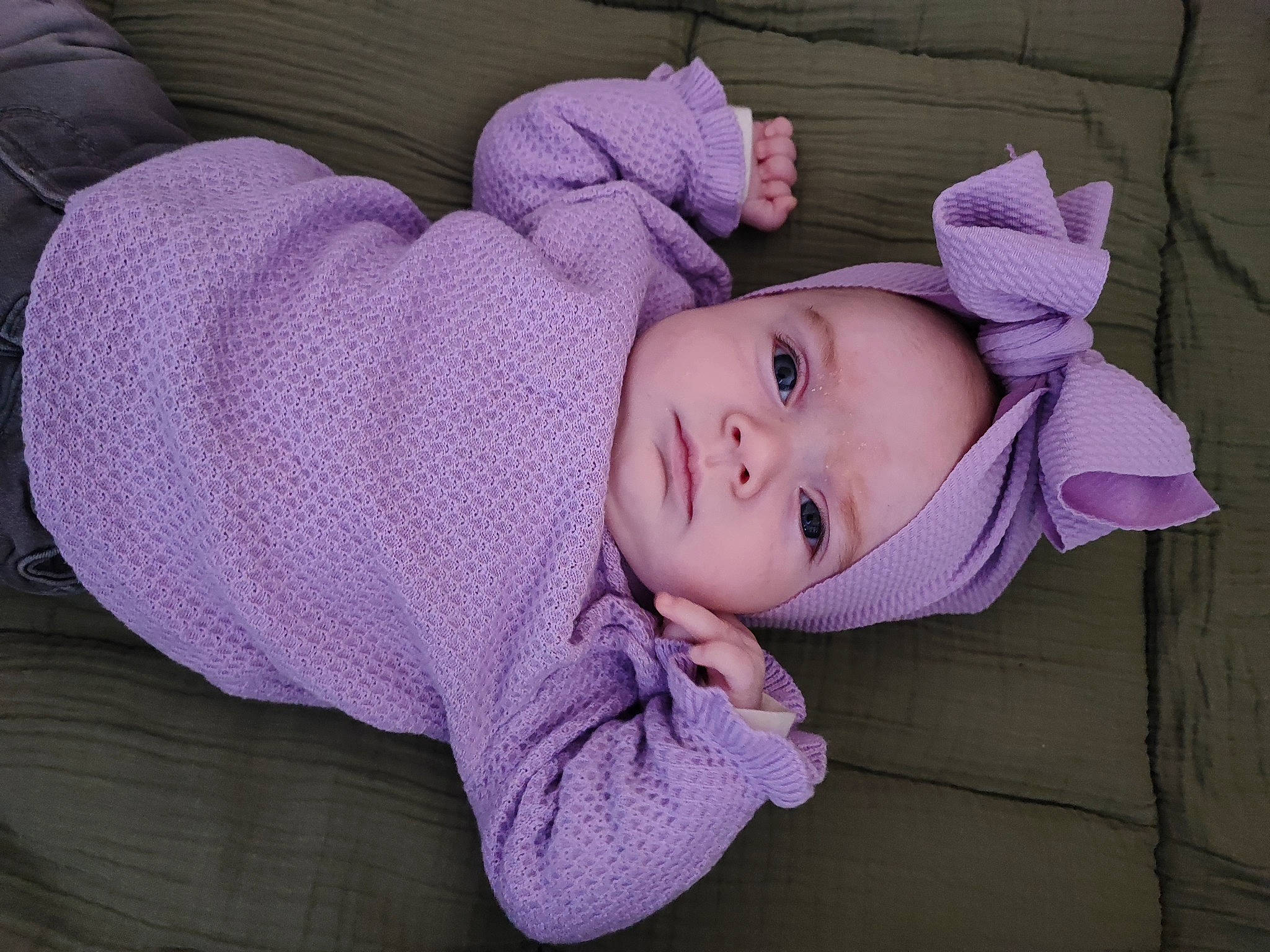 Maevy participe au concours pour gagner de l'argent avec cette photo : baby, baby_toddler_clothing, cheek, comfort, eye, face, head, headgear, headwear, human_body, iris, lip, nose, outerwear, person, pink, purple, skin, sleeve, textile