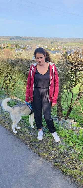 Ahines participe au concours pour gagner de l'argent avec cette photo : backpack, bag, boot, carnivore, companion_dog, dog_breed, face, goats, grass, grassland, hill, landscape, leisure, luggage_and_bags, people_in_nature, person, plant, recreation, trail, walking