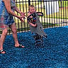 Kelly Kay joined the competition — help win amazing prizes! baby, blue_surface, casual_clothing, child, dolphin_rocker, fence, fun, grass, outdoor, parent, park, play, playground, sandals, spring_rocker, summer, sunlight, toddler, trees, woman