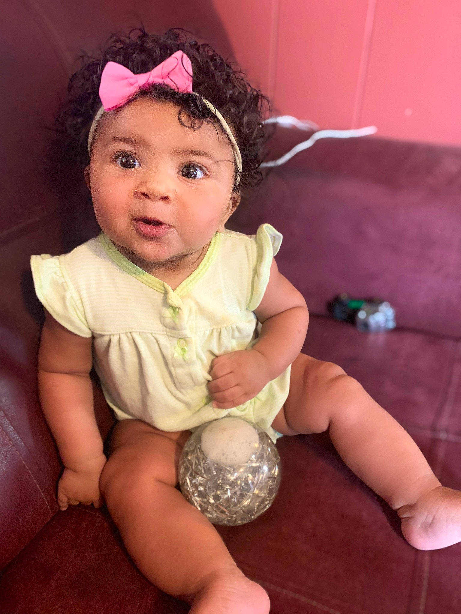 Ayani joined the competition — help win amazing prizes! baby_toddler_clothing, ball, child, costume_hat, finger, flash_photography, flooring, foot, fun, happy, headband, headpiece, headwear, human_leg, iris, magenta, person, pink, skin, thigh