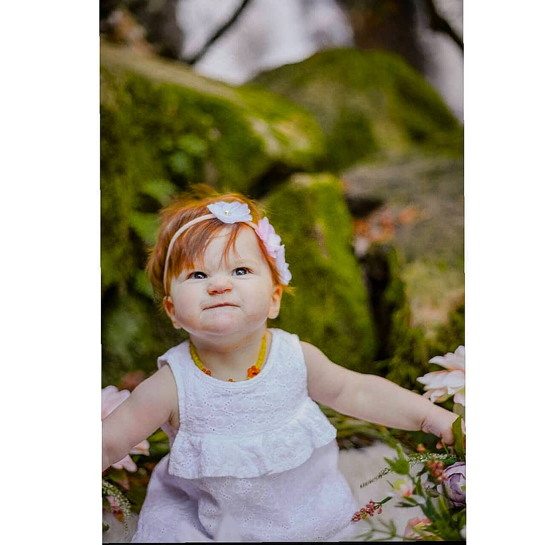 Nora June joined the competition — help win amazing prizes! child, child_model, figurine, grass, person, photograph, photography, plant, portrait, portrait_photography, smile, toddler, tree, wildflower