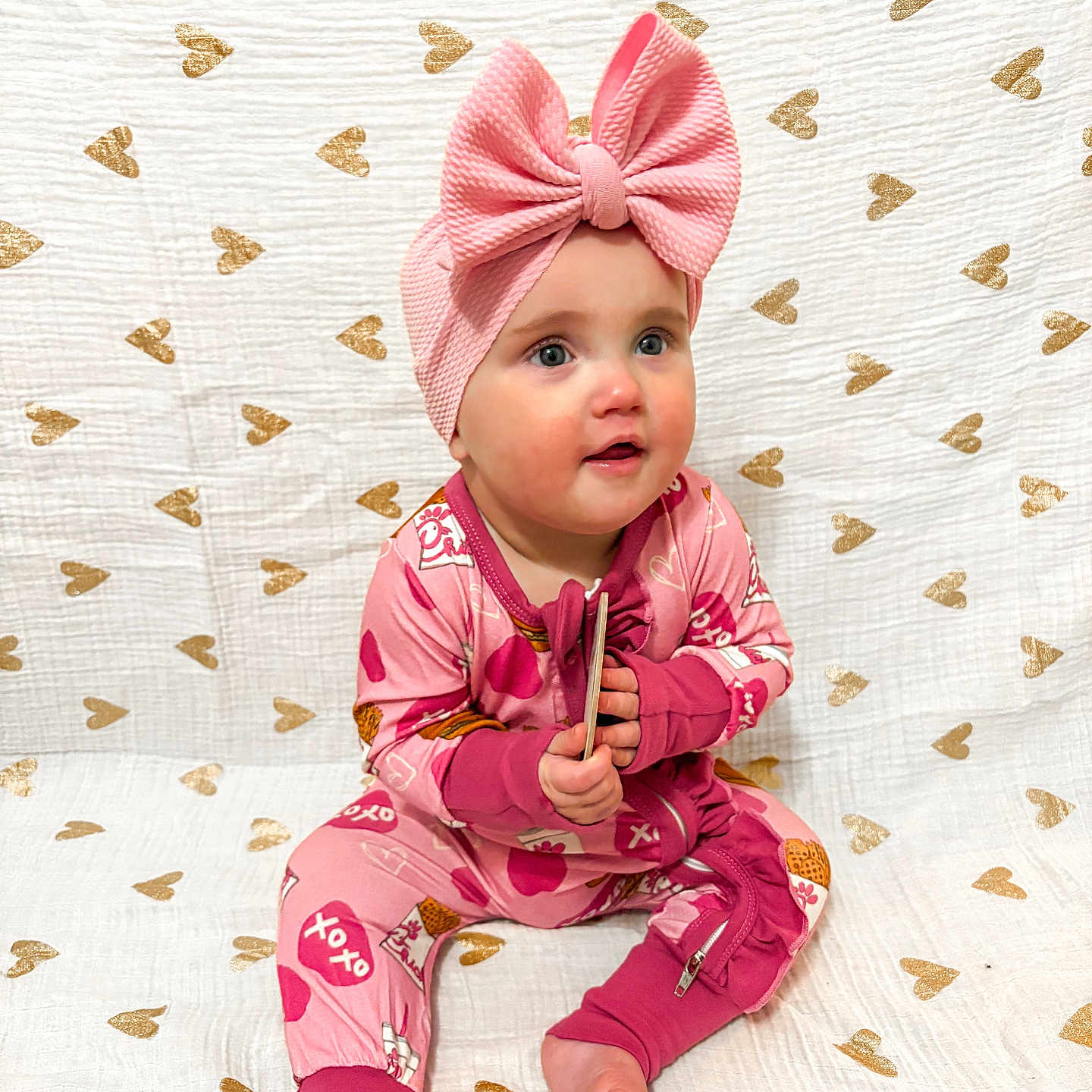 Wrenley is registered to the contest to win money with this photo: accessories, baby, bodypart, bonnet, cap, clothing, dress, face, fashion, finger, formalwear, gown, hand, hat, head, pajamas, person, photography, portrait, sitting