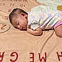 Jayleen is registered to the contest to win money with this photo: baby, sleeping, onesie, pastel_colors, blanket, numbers, letters, ring, infant, peaceful, soft_texture, cute, child, lying_down, indoors, head, face, arm, leg, nap