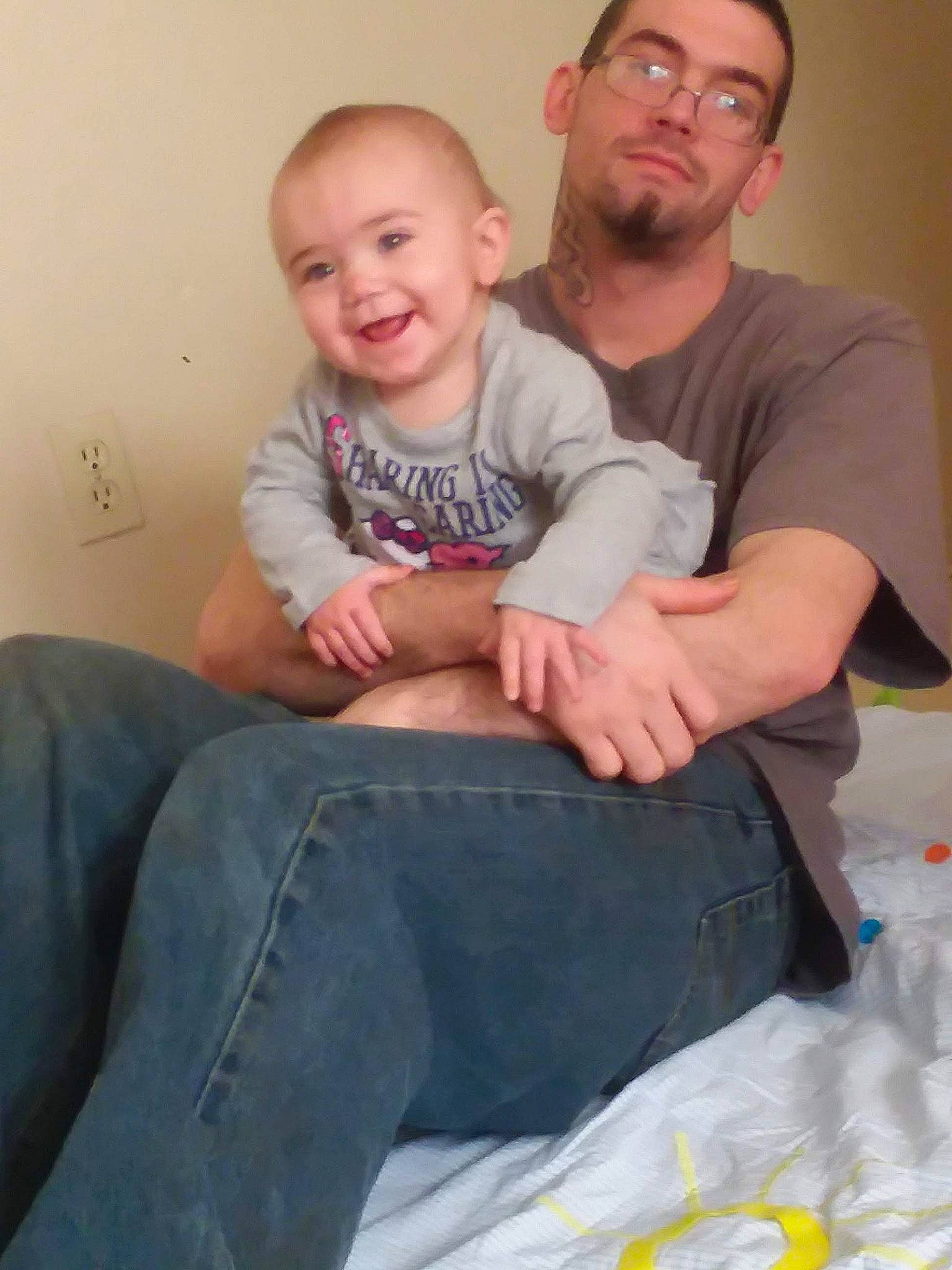 Kailee is registered to the contest to win money with this photo: arm, child, day, ear, father, finger, forehead, fun, hair, joy, leg, man, mother, nose, people, person, product, sitting, smile, toddler