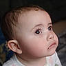 Scarlett is registered to the contest to win money with this photo: baby, child, face, portrait, curious, wide_eyes, chubby_cheeks, soft_lighting, closeup, infant, looking_up, cute, young_child, indoor, wearing_clothes, skin, head, expression, person, toddler