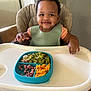 baby, babylaughing, chair, cutlery, eating, face, food, furniture, guacamole, happy, head, highchair, lunch, meal, person, photography, portrait, smile, spoon, table