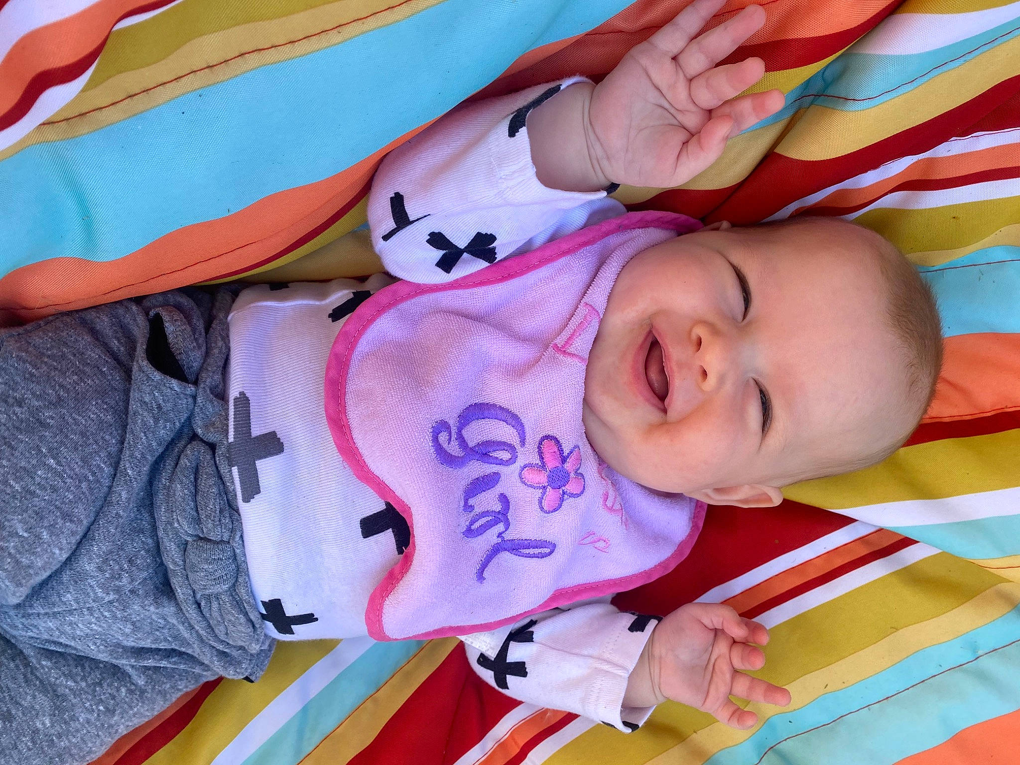 Zoie is registered to the contest to win money with this photo: baby, baby_products, baby_toddler_clothing, cheek, child, eye, fun, hand, happy, head, lip, nose, pattern, person, pink, red, skin, sleeve, smile, toddler