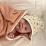 Apolline participe au concours pour gagner de l'argent avec cette photo : baby, blanket, child, comfort, cozy, cute, expression, face, hand, hood, indoors, infant, lying_down, newborn, portrait, skin, soft_texture, star_pattern, towel, wrapped