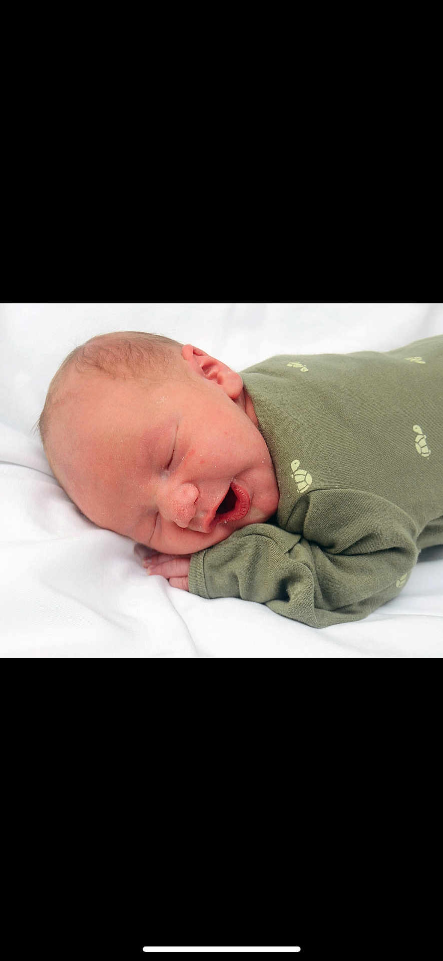 Sawyer joined the competition — help win amazing prizes! baby, newborn, sleeping, infant, green_clothing, turtle_print, white_background, peaceful, cute, small_hand, closed_eyes, soft_skin, lying_down, portrait, cozy, resting, child, face, head, adorable