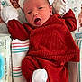 Sawyer is registered to the contest to win money with this photo: baby, infant, mittens, socks, blanket, towel, baby_wipes, face, clothing, newborn, lying_down, patterned_blanket, cute, cozy, soft, small, child, indoor, portrait, resting