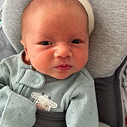 Sawyer joined the competition — help win amazing prizes! baby, infant, face, eyes, clothing, blue_outfit, cow_patch, cushion, soft, close_up, newborn, child, portrait, indoors, cute, expression, skin, head, sleeve, button