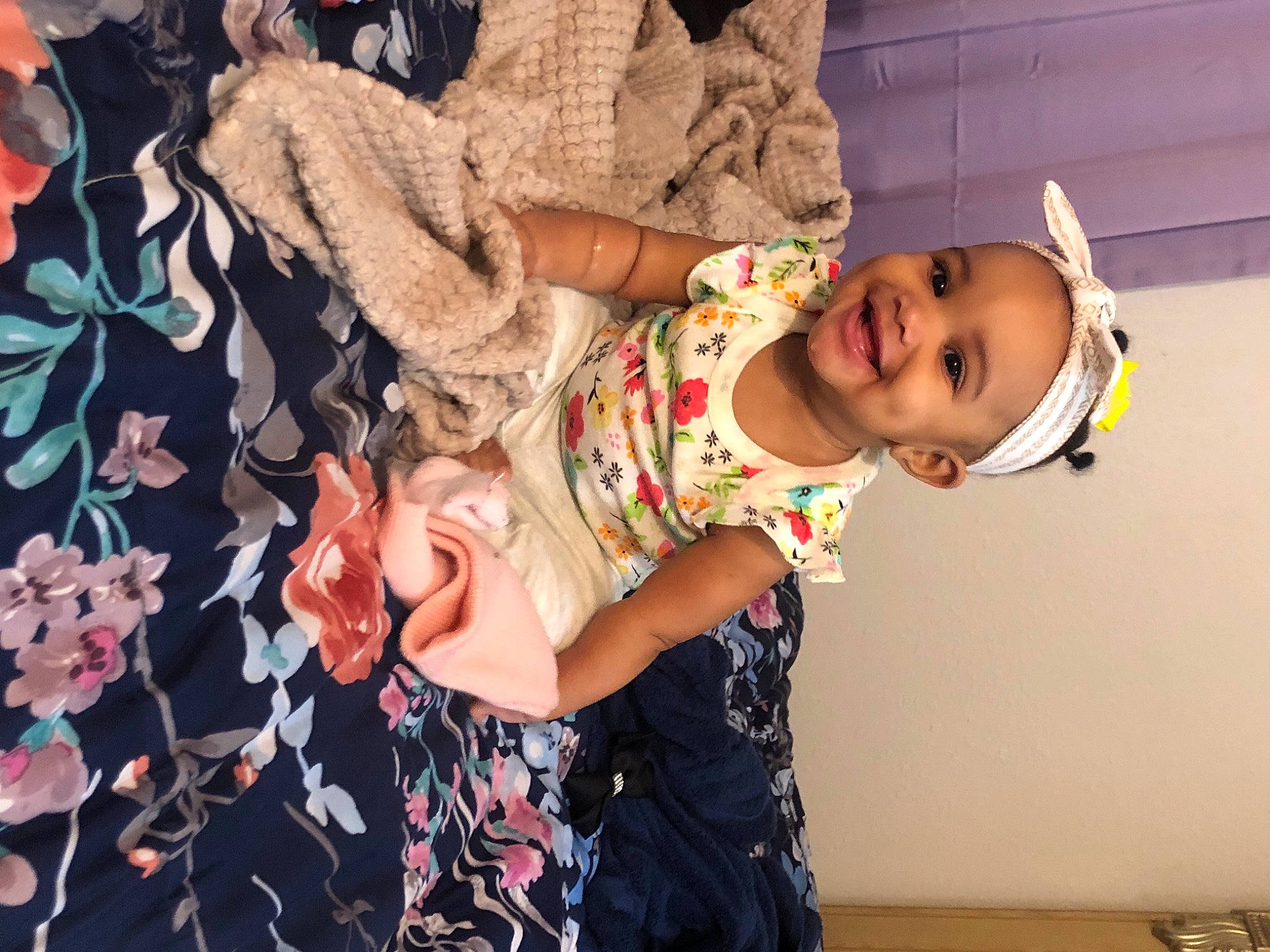 Elle is registered to the contest to win money with this photo: baby, baby_toddler_clothing, fur, joy, person, plush, stuffed_toy, toddler, toy