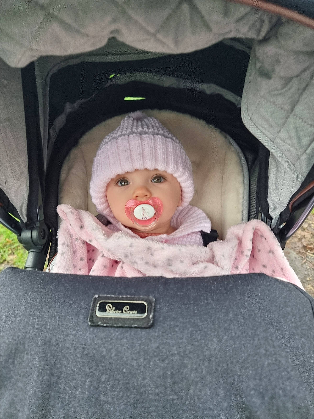 Evie joined the competition — help win amazing prizes! baby, baby_carriage, baby_products, baby_safety, baby_sleeping, baby_toddler_clothing, cheek, child, comfort, doll, eye, head, headgear, headwear, infant_bed, mammal, organ, person, pink, skin