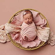 Remington joined the competition — help win amazing prizes! newborn, baby, swaddle, pink, basket, blanket, headband, sleeping, portrait, studio, soft_texture, tiny_toes, cute, infant, newborn_photoshoot, peaceful, wrapped, fabric, props, closeup