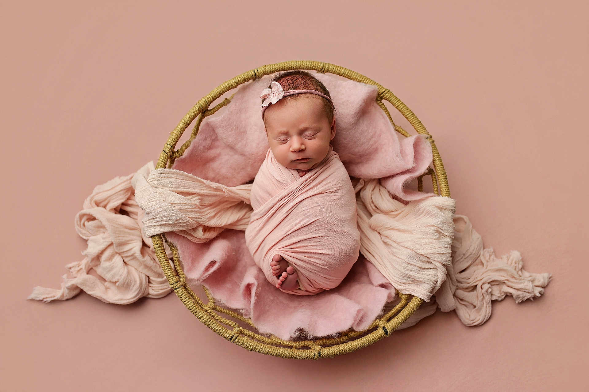 Remington joined the competition — help win amazing prizes! newborn, baby, swaddle, pink, basket, blanket, headband, sleeping, portrait, studio, soft_texture, tiny_toes, cute, infant, newborn_photoshoot, peaceful, wrapped, fabric, props, closeup
