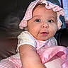 baby, infant, child, portrait, face, smiling, happy, pink, bonnet, hat, dress, clothing, sitting, indoor, chair, window, close_up, photography, reaching, cute