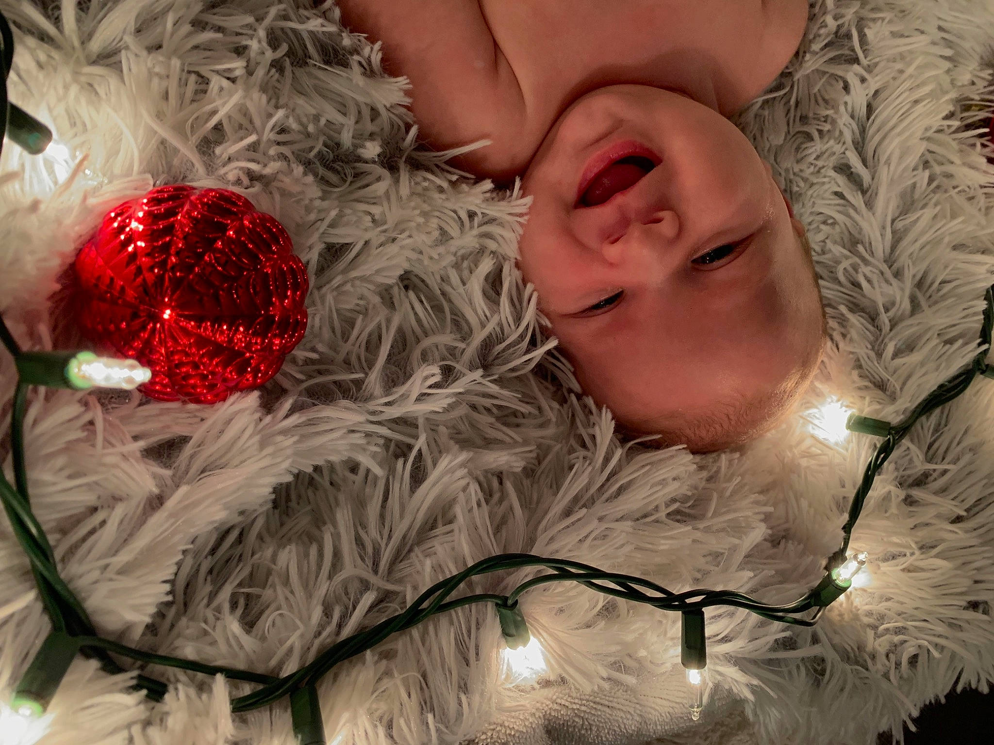 Tory joined the competition — help win amazing prizes! baby, carmine, christmas, christmas_decoration, christmas_eve, christmas_ornament, close_up, decoration, event, grass, happy, holiday, interior_design, light, ornament, pattern, person, smile, textile, toddler