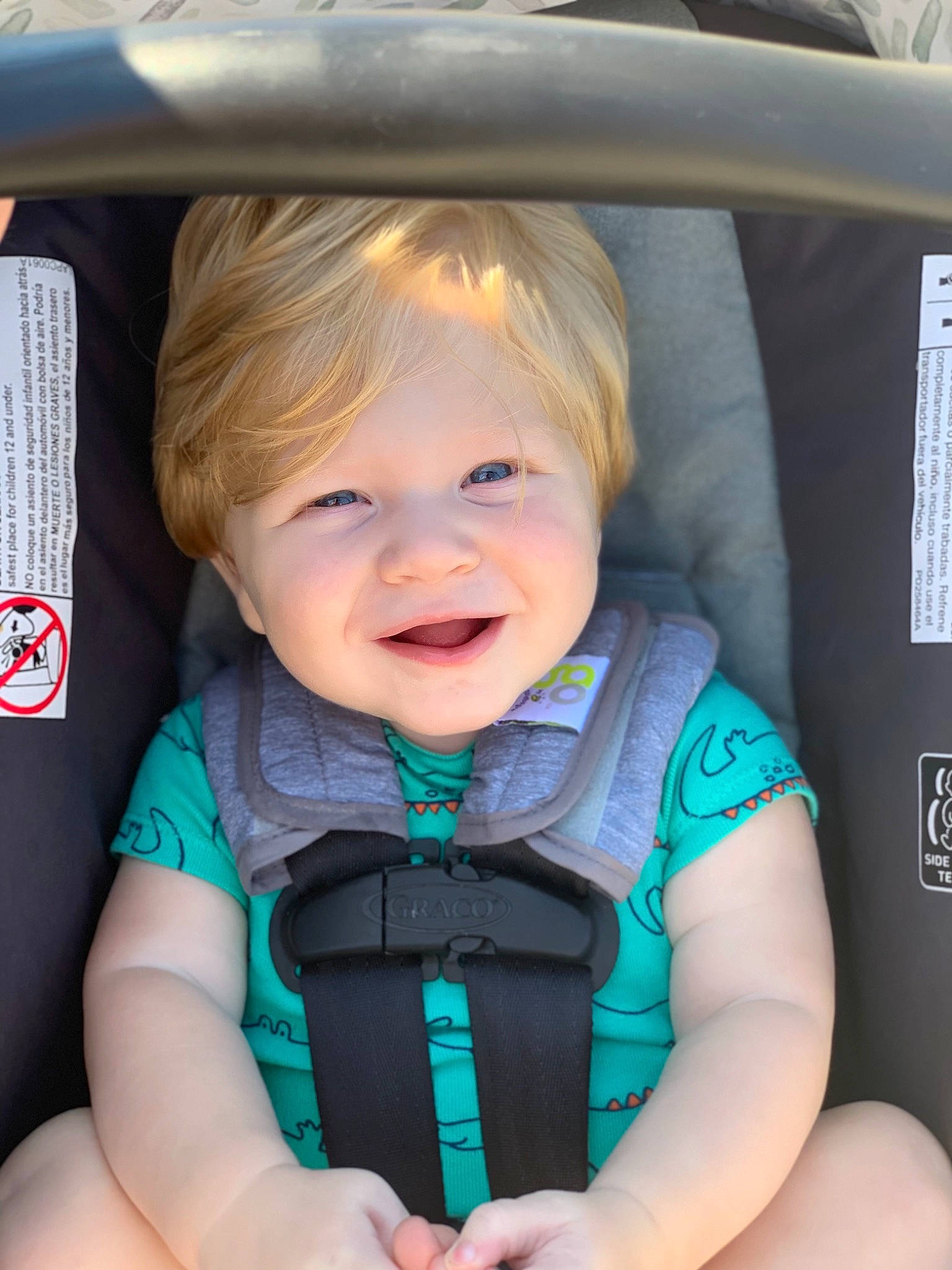 Ezra is registered to the contest to win money with this photo: auto_part, azure, baby, baby_carriage, baby_toddler_clothing, beauty, blue, car_seat, cheek, child, electric_blue, facial_expression, happy, iris, joy, person, product, seat_belt, skin, smile