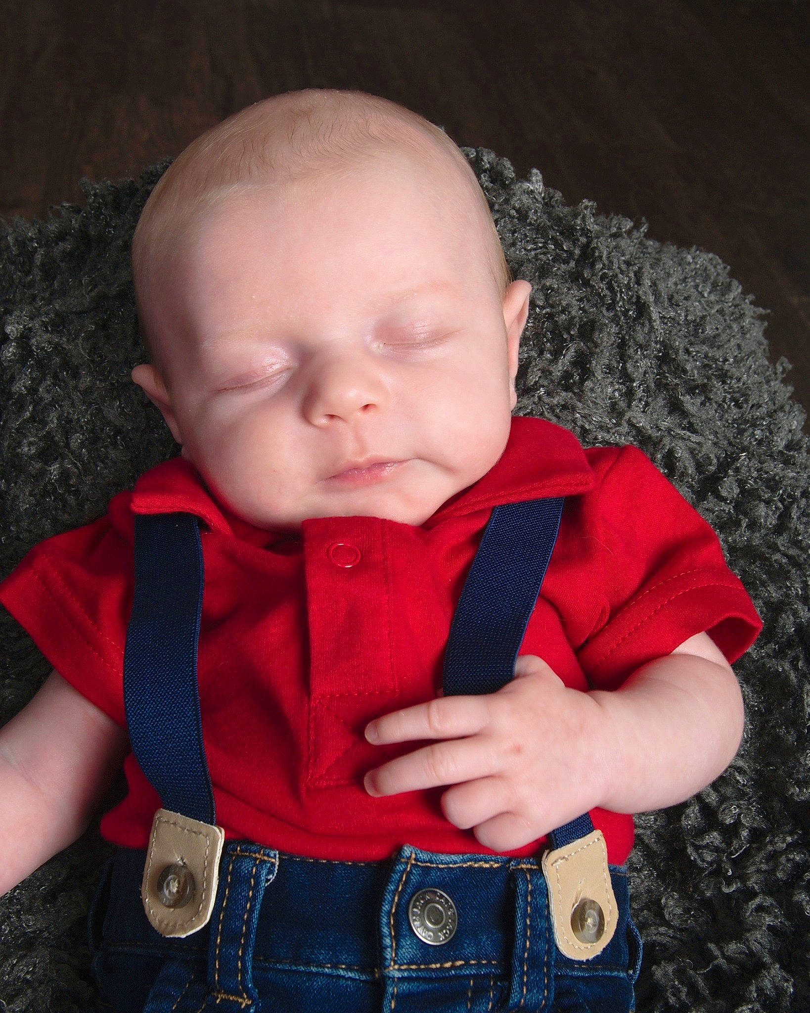 Alec is registered to the contest to win money with this photo: arm, baby, baby_toddler_clothing, cheek, child, clothing, collar, cool, eye, iris, lip, nose, organ, outerwear, person, product, skin, sleeve, standing, t_shirt