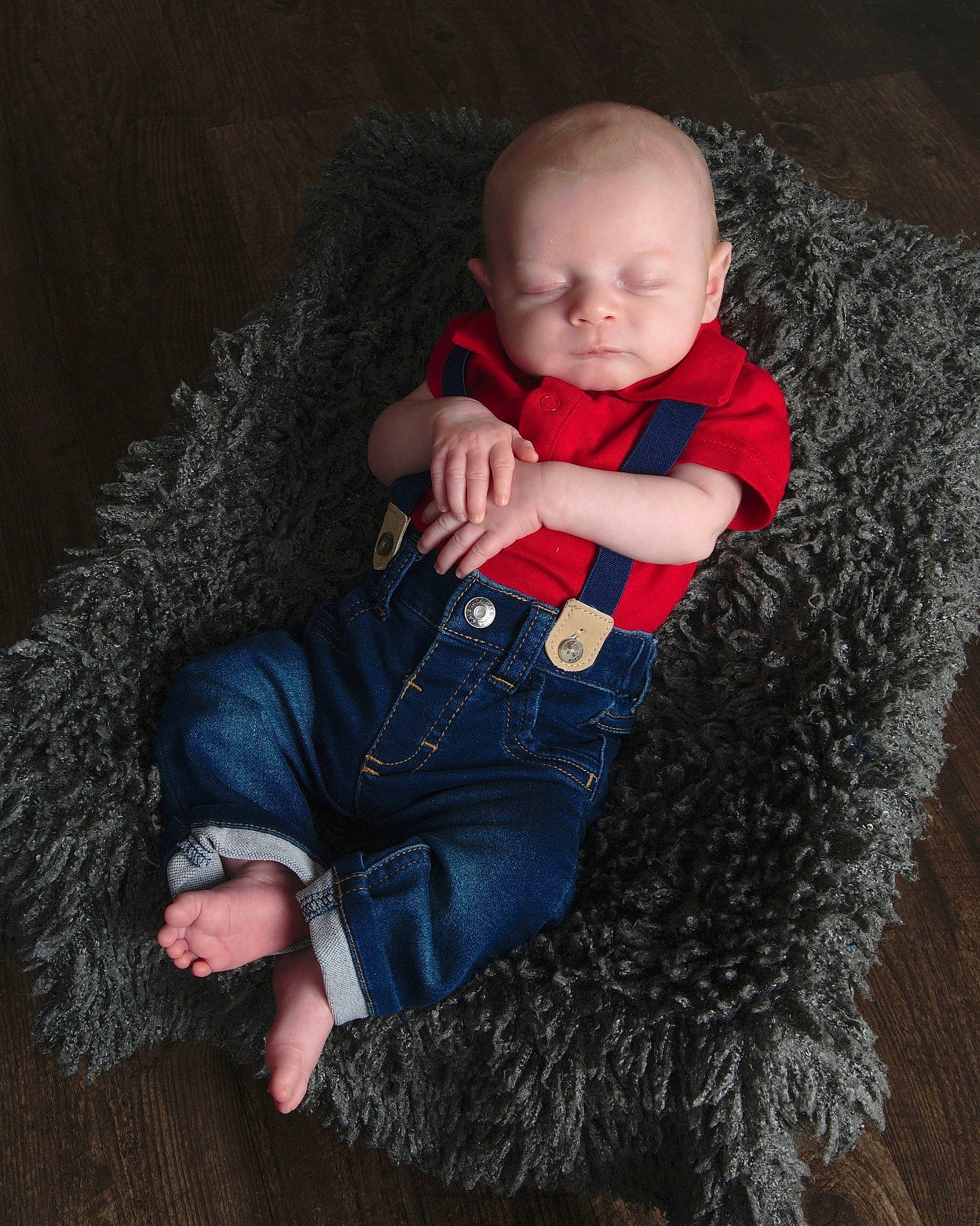 Alec is registered to the contest to win money with this photo: baby, baby_toddler_clothing, child, comfort, denim, finger, flash_photography, fur, human_leg, iris, person, sitting, skin, sleeve, t_shirt, textile, thigh, toddler, wood, wool