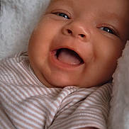 Kody-Blu joined the competition — help win amazing prizes! baby, smiling, face, blue_eyes, striped_clothing, blanket, closeup, infant, happy, cute, soft_texture, skin, cheeks, mouth_open, lying_down, newborn, child, portrait, cozy, comfort