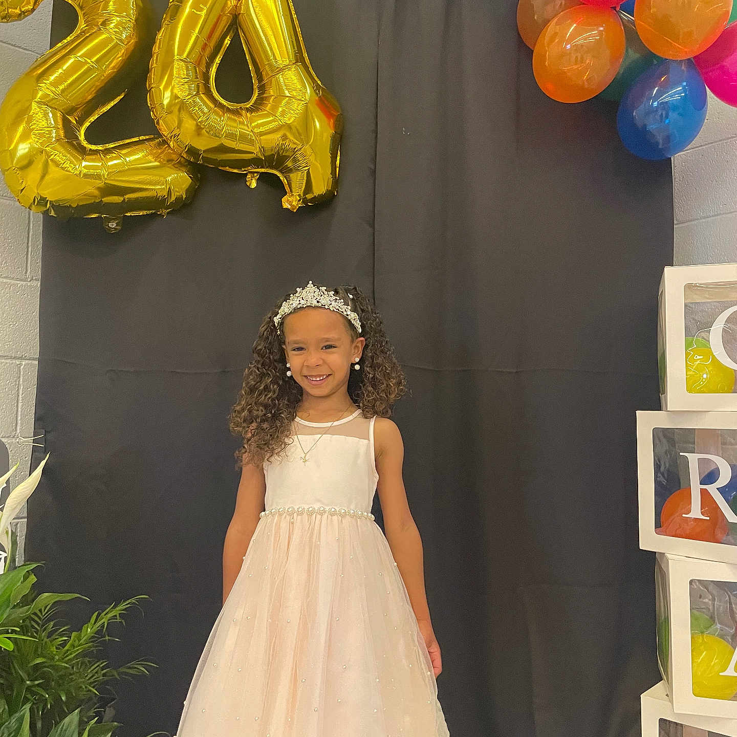 Maliah is registered to the contest to win money with this photo: accessories, balloon, child, clothing, dress, eveningdress, face, female, formalwear, girl, hair, head, jewelry, necklace, number, person, photography, sphere, symbol, text
