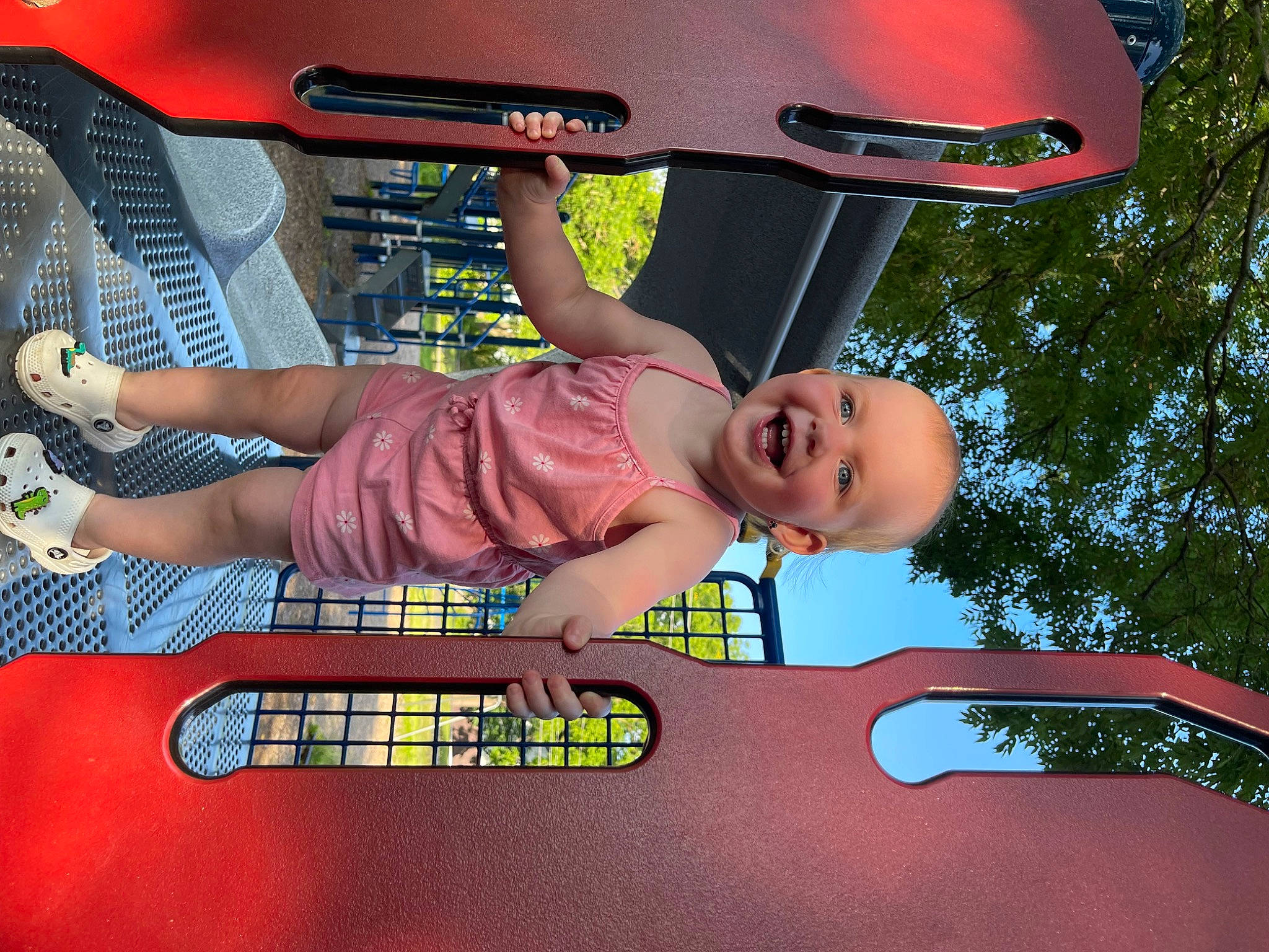 Brynlee is registered to the contest to win money with this photo: auto_part, automotive_design, automotive_exterior, automotive_lighting, bumper, child, family_car, fun, happy, joy, leisure, magenta, motor_vehicle, pattern, person, play, recreation, smile, t_shirt, toddler