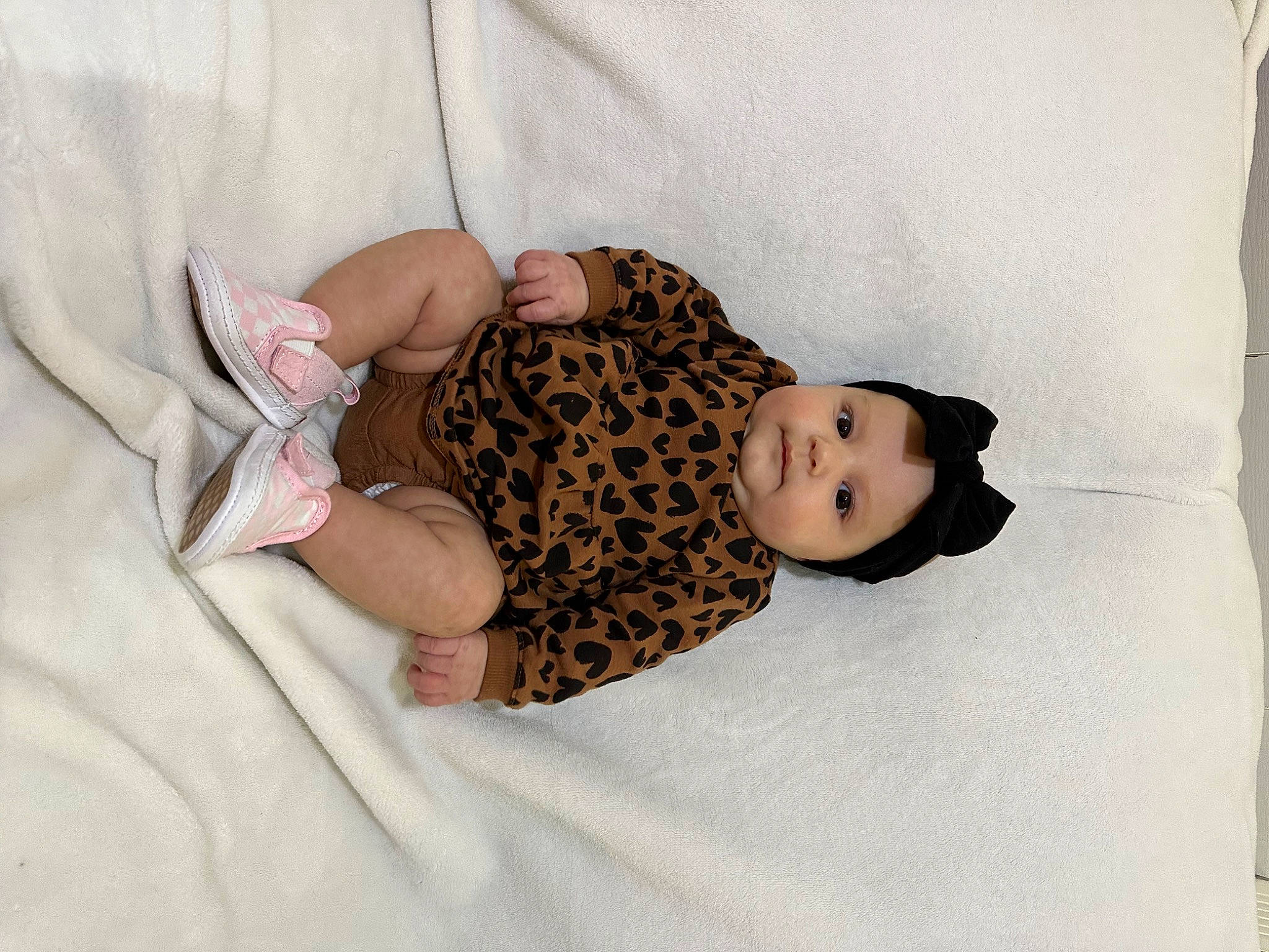 Brooklynn is registered to the contest to win money with this photo: arm, bed, bedding, child, comfort, dress, fur, hand, headwear, human_body, human_leg, knee, leg, linens, mammal, neck, pattern, person, skin, sleeve