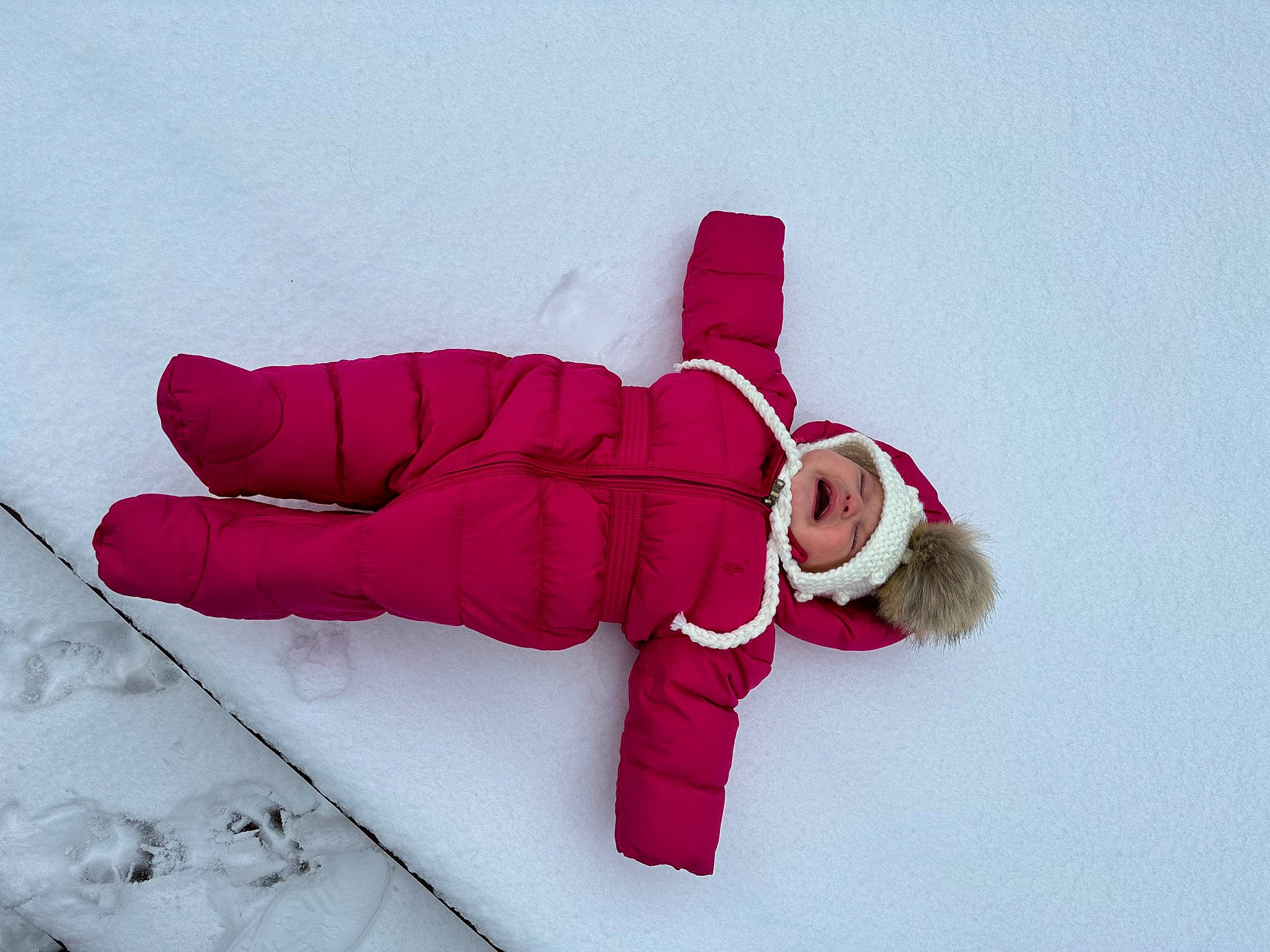 Brooklynn is registered to the contest to win money with this photo: baby_toddler_clothing, carmine, freezing, fun, gesture, glove, happy, headwear, magenta, parka, person, recreation, sleeve, slope, snow, toddler, winter, wrist