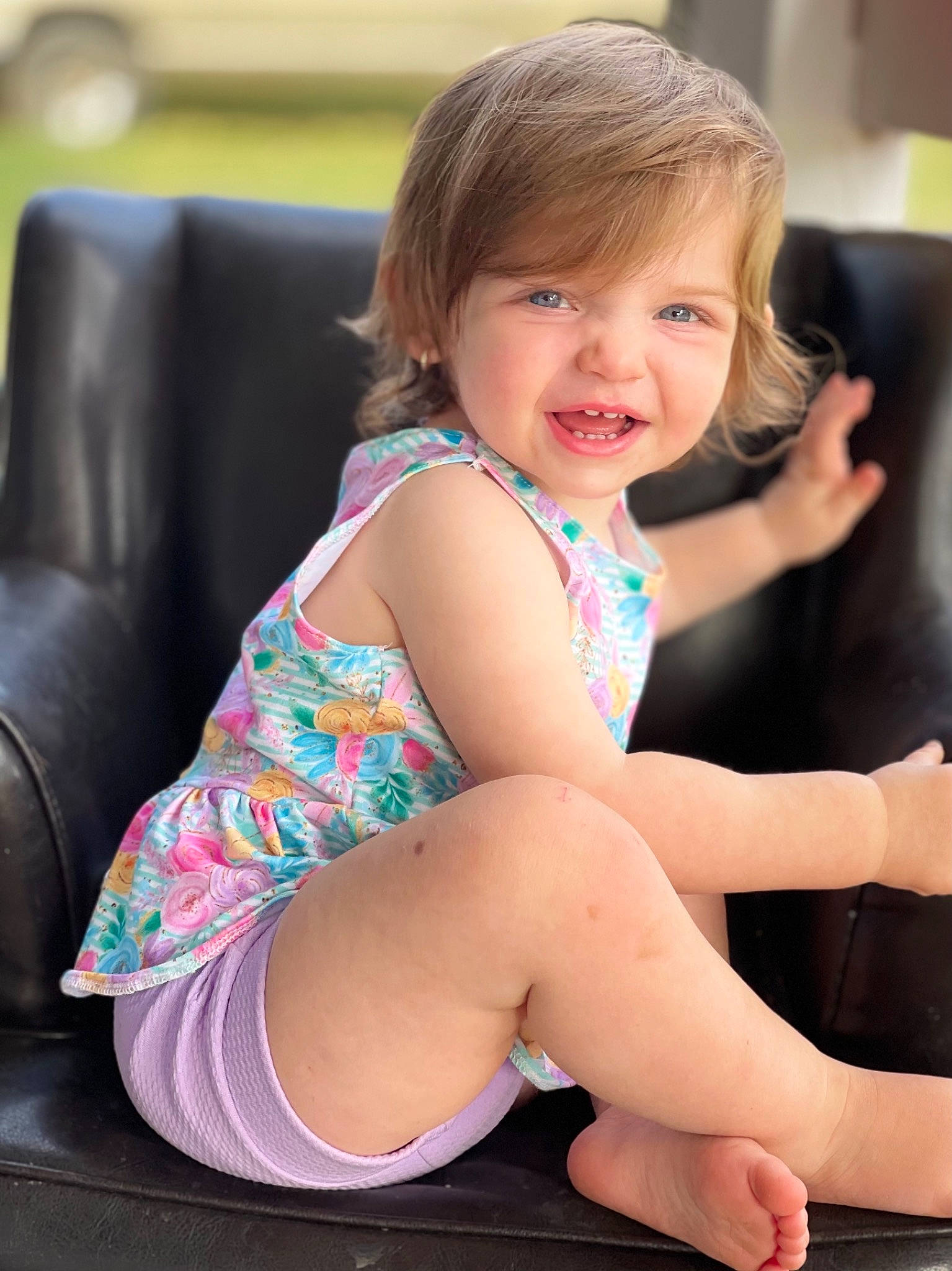 Hadley is registered to the contest to win money with this photo: child, comfort, face, finger, hair, happy, head, human_body, joint, knee, lap, leg, leisure, person, pink, shoulder, skin, smile, thigh, toddler
